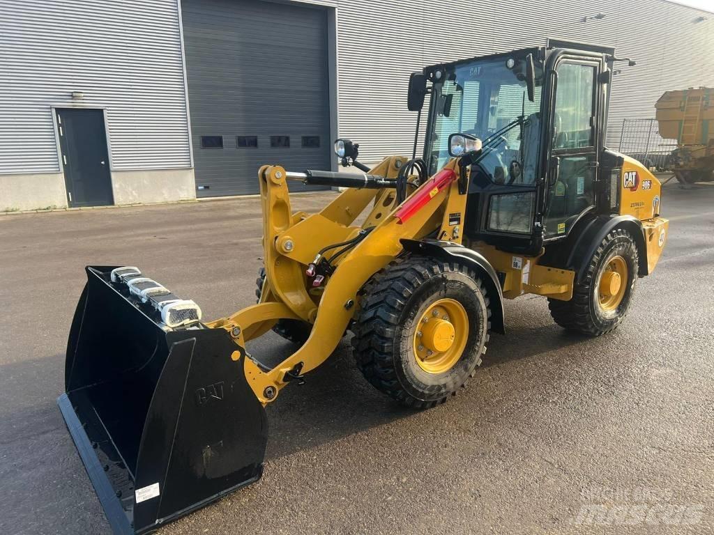 CAT 906 Iekrāvēji uz riteņiem