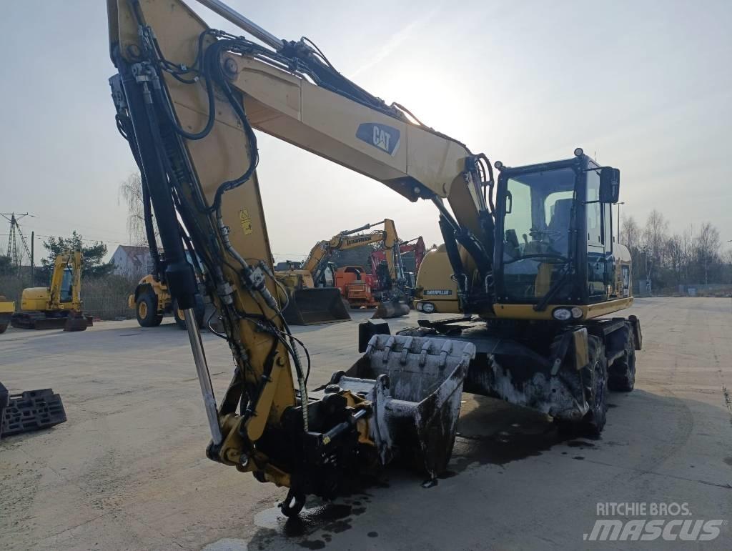 CAT M 313 D Ekskavatori uz riteņiem