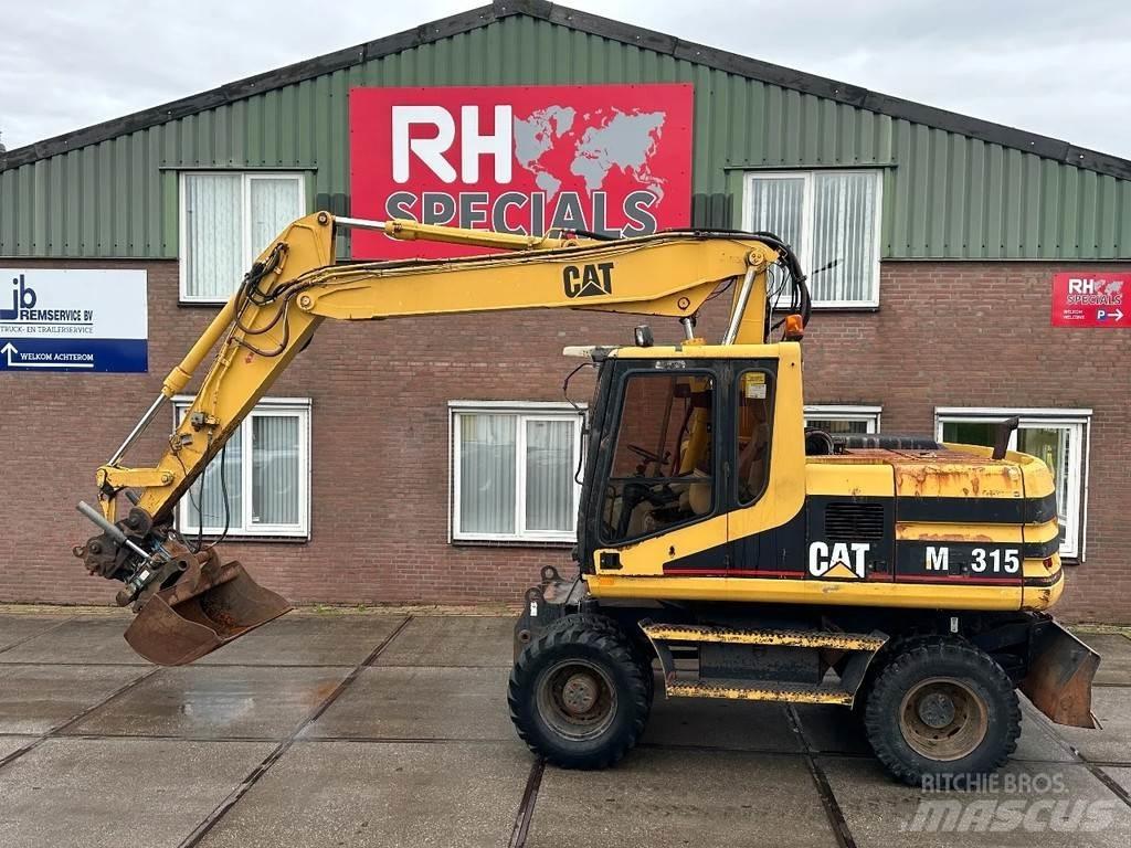 CAT M315 +ROTO CE Ekskavatori uz riteņiem