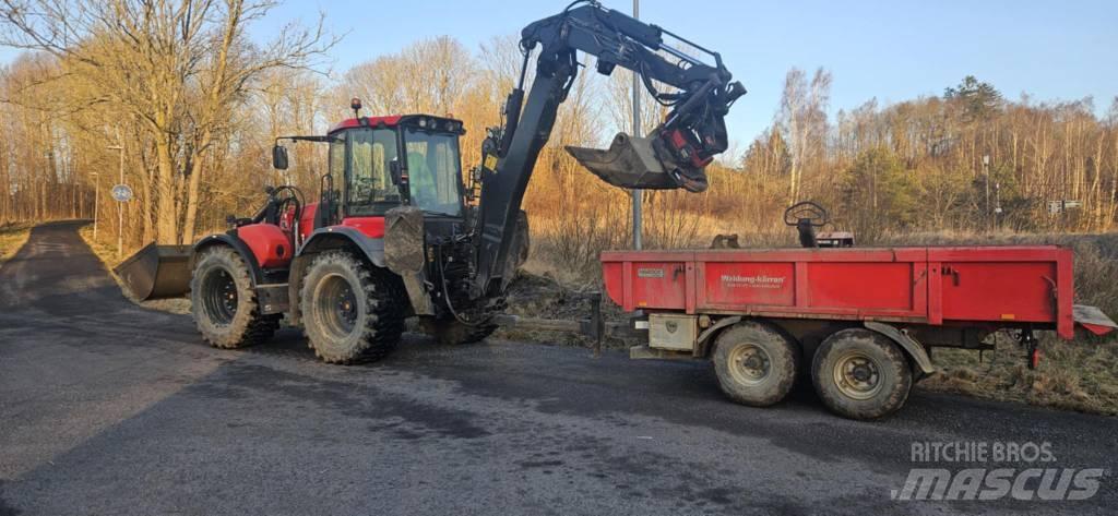 Huddig 1260 C Ekskavatori ar kausu priekšā