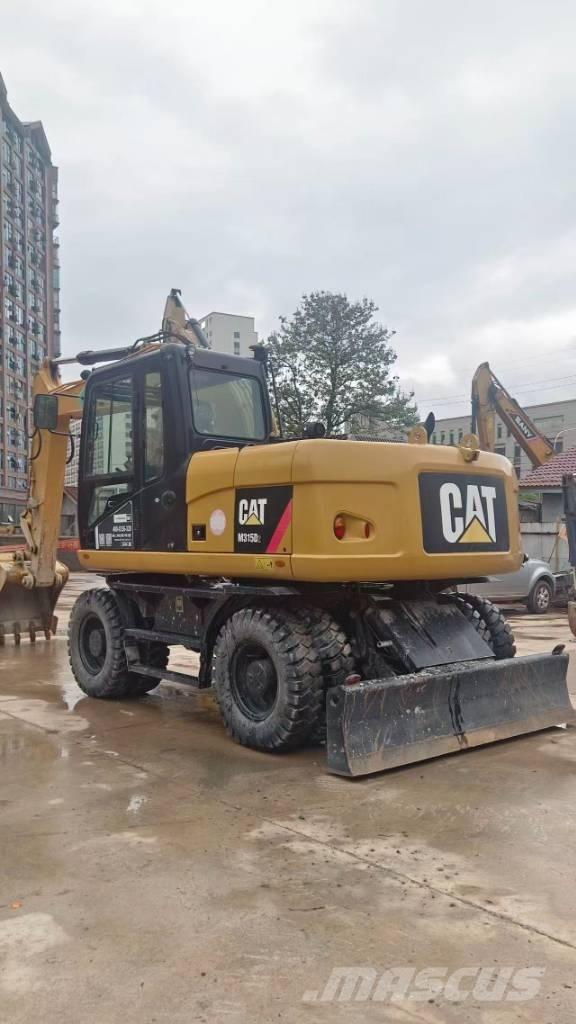CAT M 315 D Ekskavatori uz riteņiem
