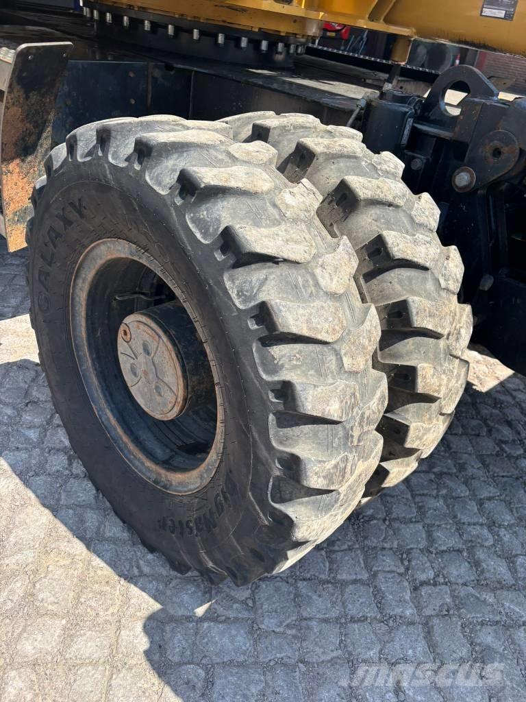 CAT M 313 D Ekskavatori uz riteņiem