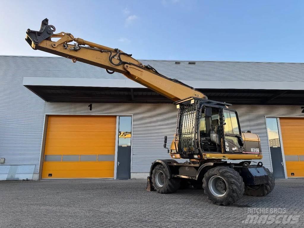 CAT M315C Ekskavatori uz riteņiem