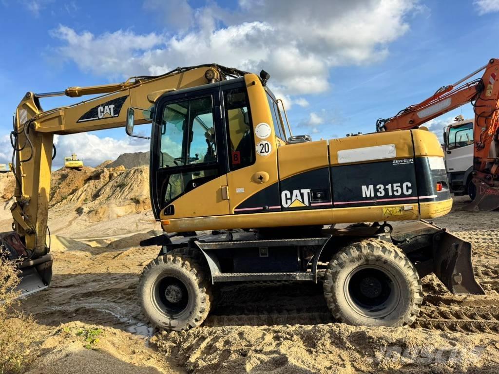 CAT M 315 C Ekskavatori uz riteņiem