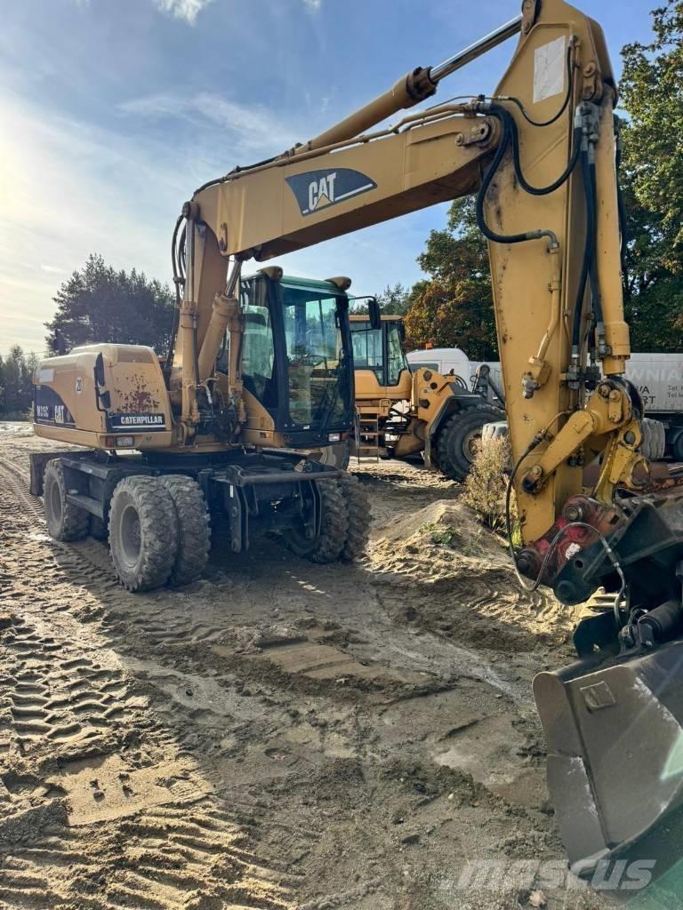 CAT M 315 C Ekskavatori uz riteņiem