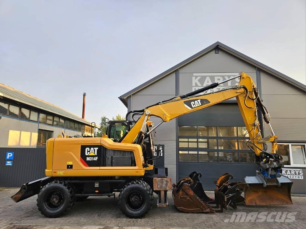 CAT M 314 Ekskavatori uz riteņiem