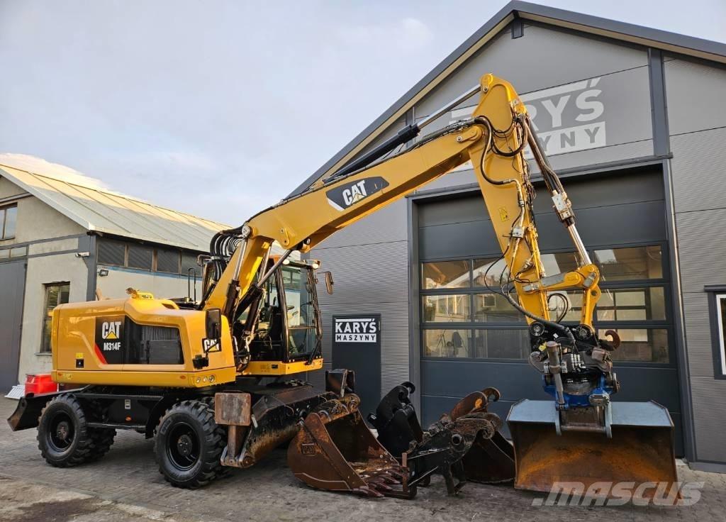 CAT M 314 Ekskavatori uz riteņiem
