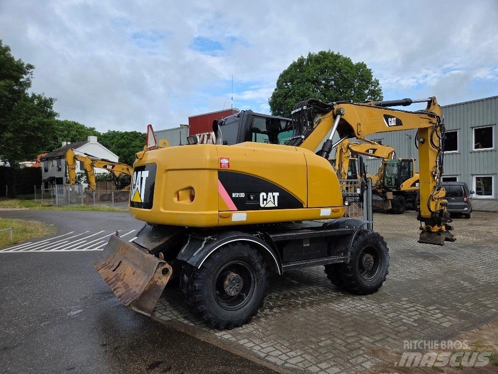 CAT M313D Ekskavatori uz riteņiem