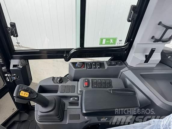 CAT 906 Iekrāvēji uz riteņiem