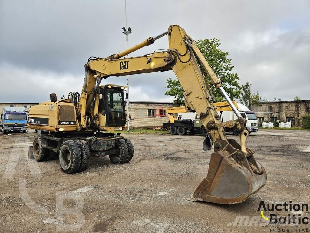 CAT M 318 C Ekskavatori uz riteņiem