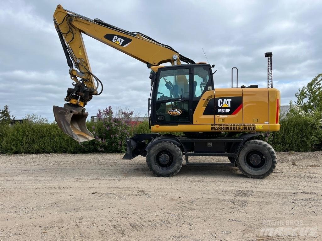 CAT M 318 F Ekskavatori uz riteņiem
