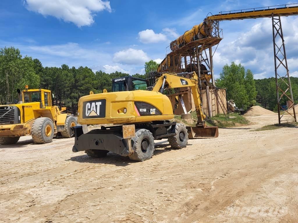 CAT M318d Ekskavatori uz riteņiem