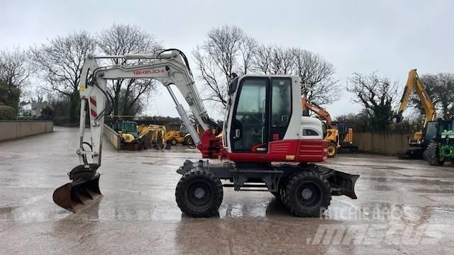 Takeuchi TB295W Ekskavatori uz riteņiem