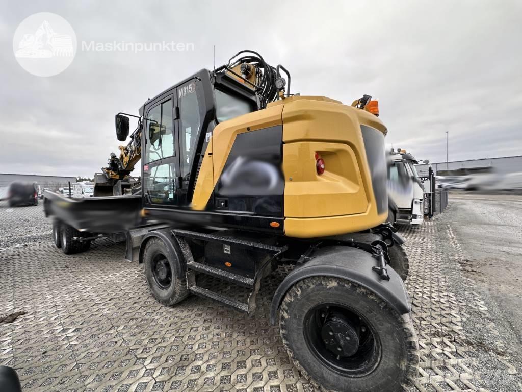 CAT M 315 Ekskavatori uz riteņiem