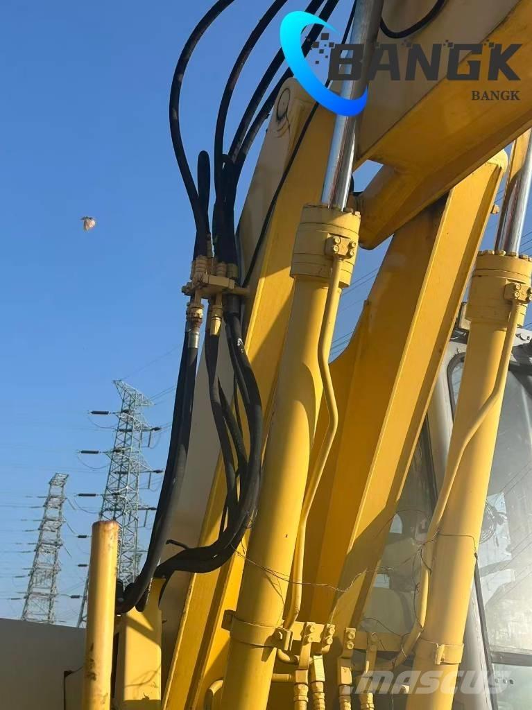  KOMΛ1'SU PW128us Ekskavatori uz riteņiem