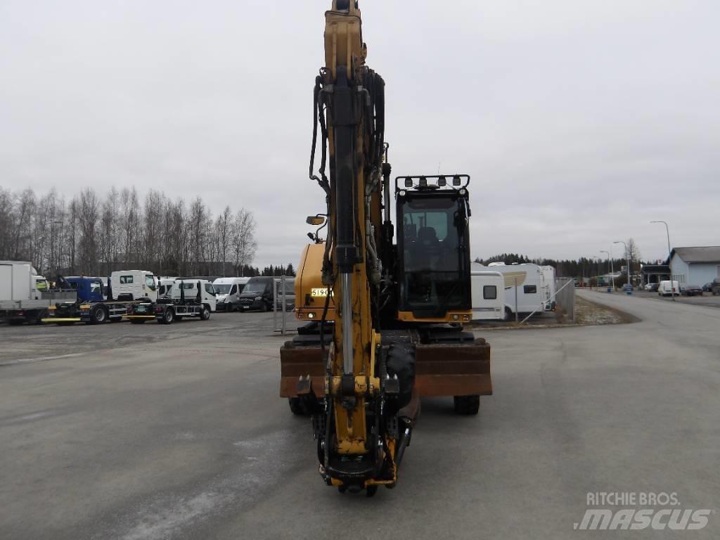 CAT M 318 Ekskavatori uz riteņiem