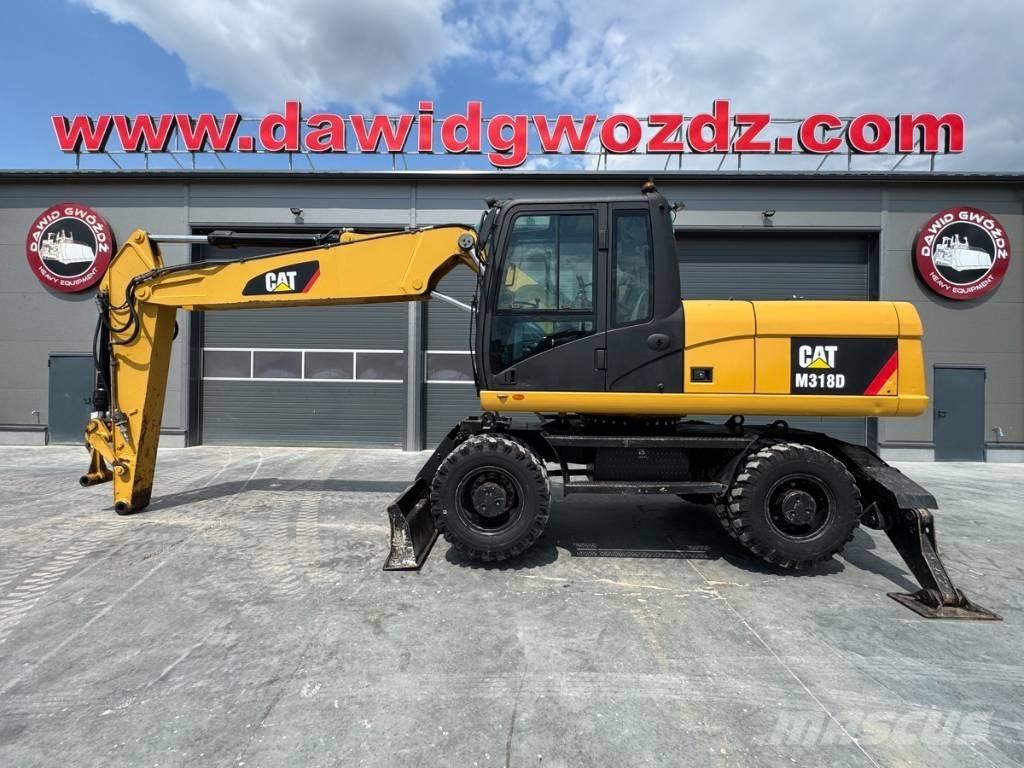 CAT M 318 D Ekskavatori uz riteņiem