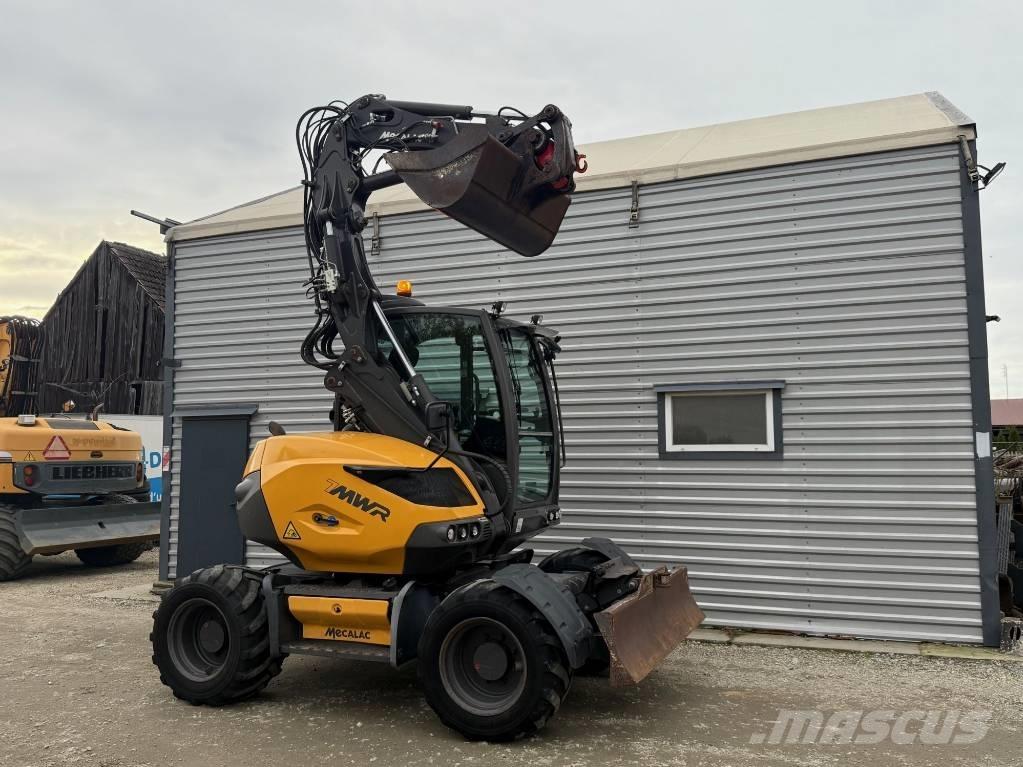 Mecalac 7 MWR Ekskavatori uz riteņiem