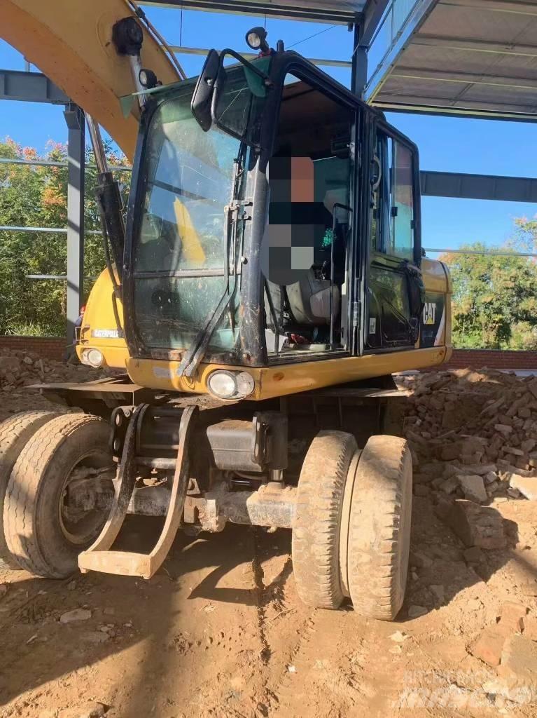 CAT 315 D Ekskavatori uz riteņiem