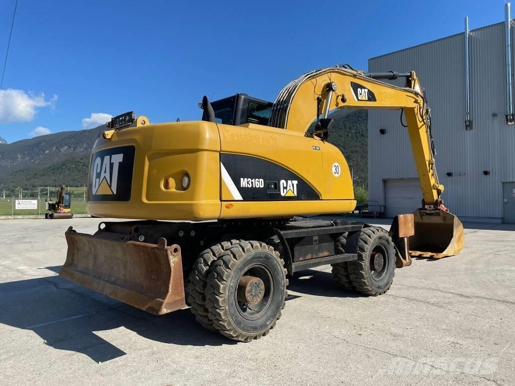 CAT M 316 D Ekskavatori uz riteņiem