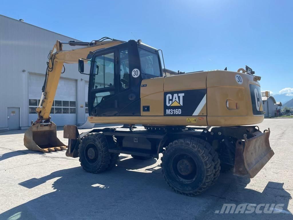 CAT M 316 D Ekskavatori uz riteņiem