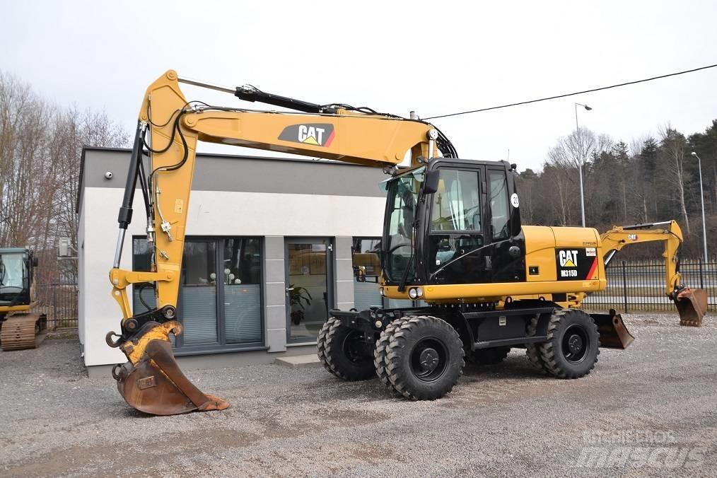 CAT M 315 D Ekskavatori uz riteņiem