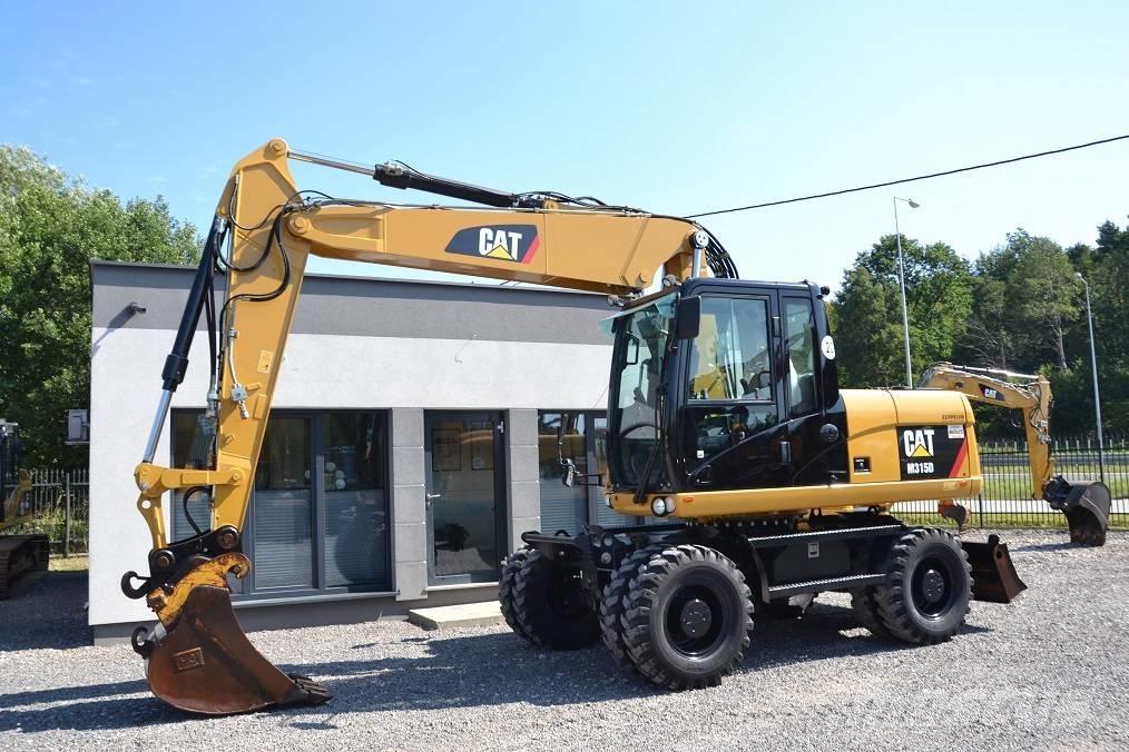 CAT M 315 D Ekskavatori uz riteņiem