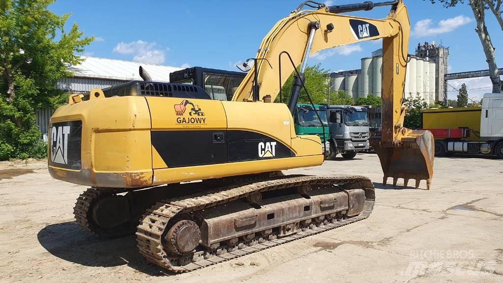 CAT 329 D Ekskavatori tālās sniedzamības darbiem
