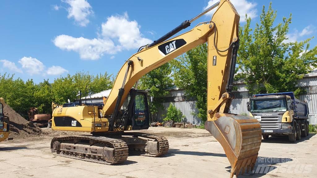 CAT 329 D Ekskavatori tālās sniedzamības darbiem