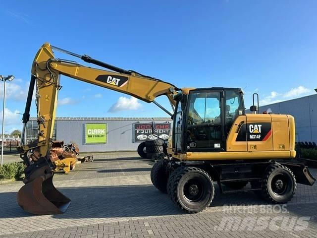 CAT M 314 F Ekskavatori uz riteņiem