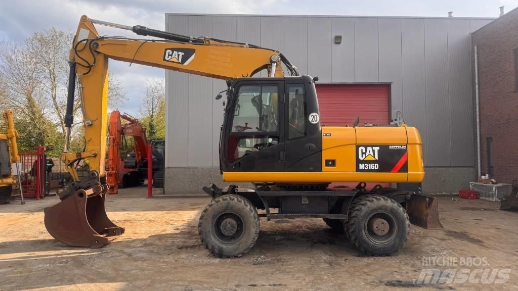 CAT M 316 D Ekskavatori uz riteņiem
