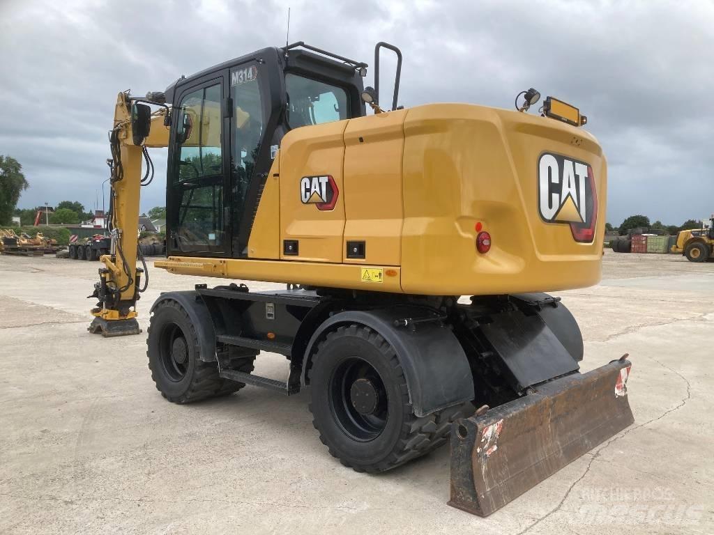 CAT M314 Ekskavatori uz riteņiem