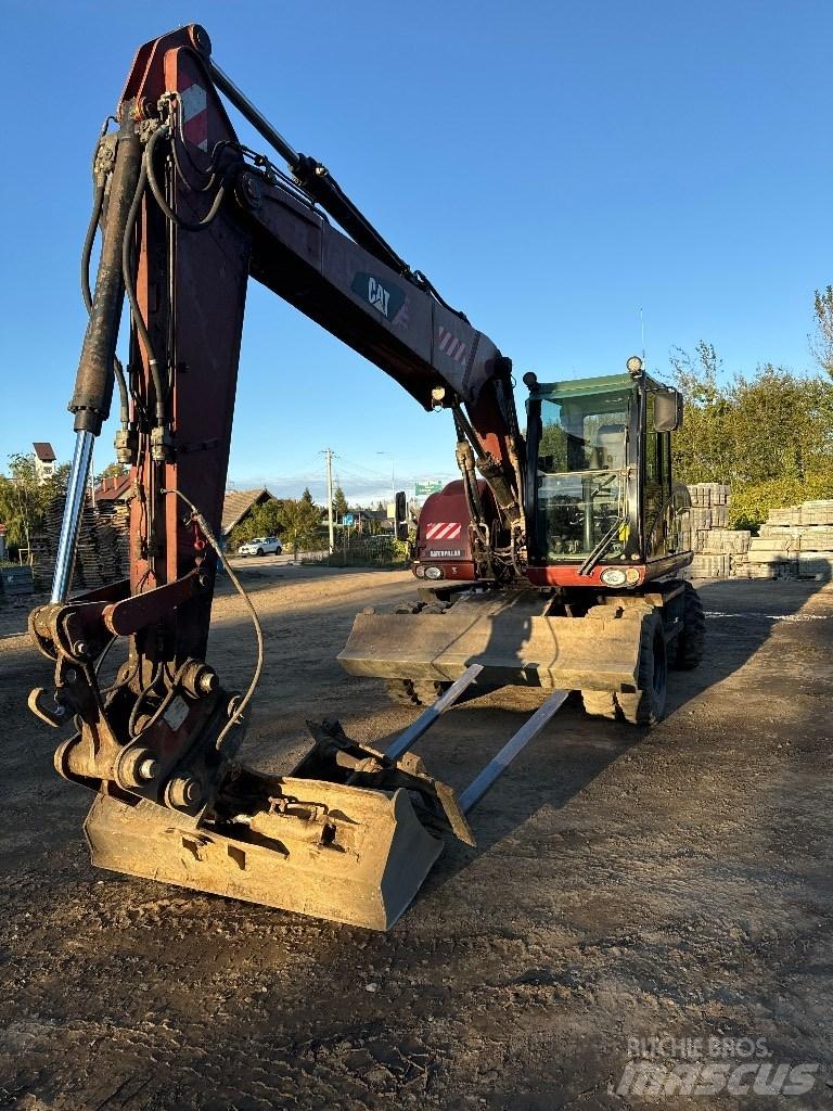 CAT 313 D Ekskavatori uz riteņiem