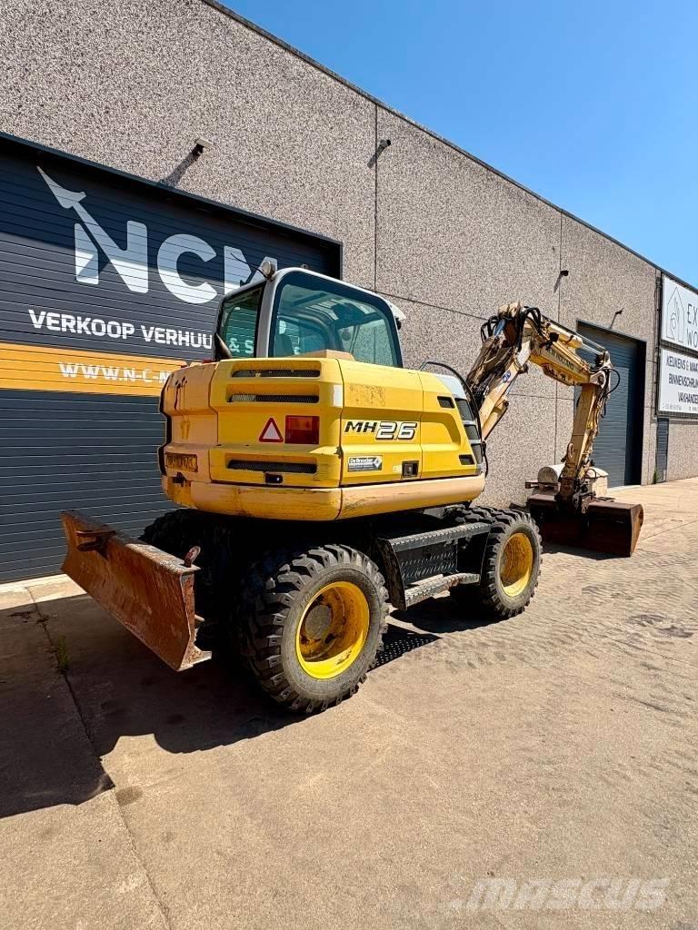 New Holland MH 2.6 Ekskavatori uz riteņiem