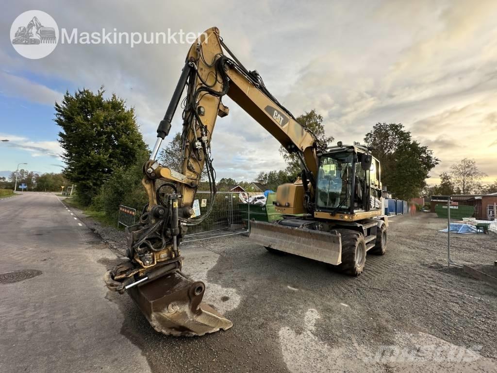 CAT M 317 Ekskavatori uz riteņiem