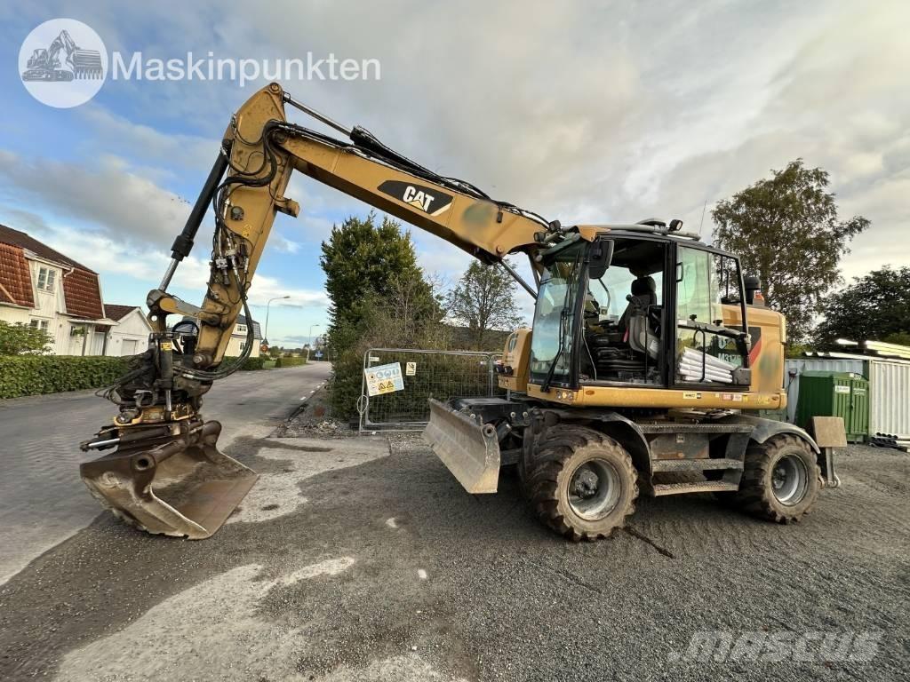 CAT M 317 Ekskavatori uz riteņiem