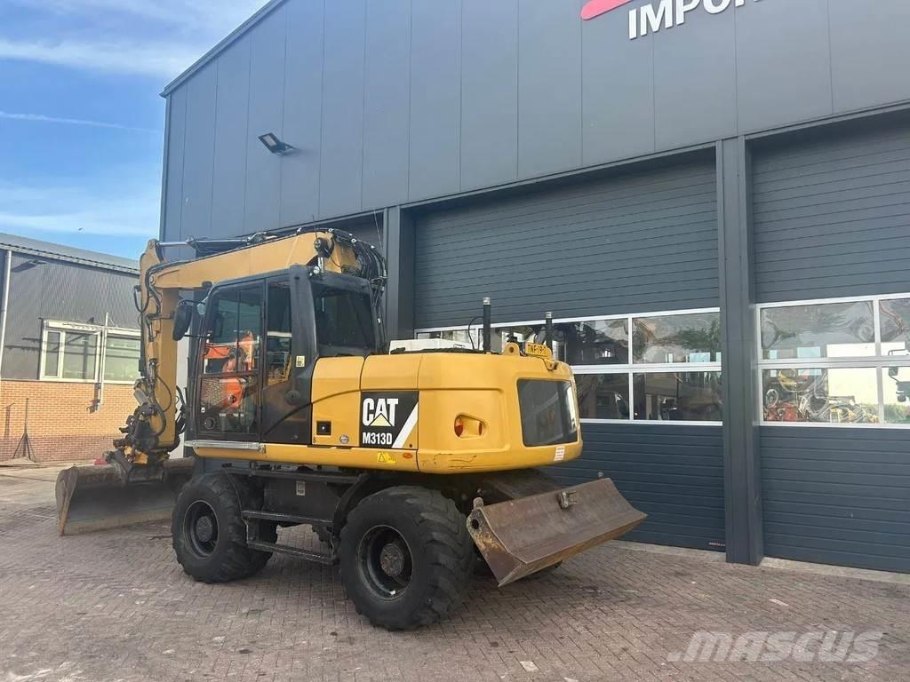 CAT M313D Ekskavatori uz riteņiem