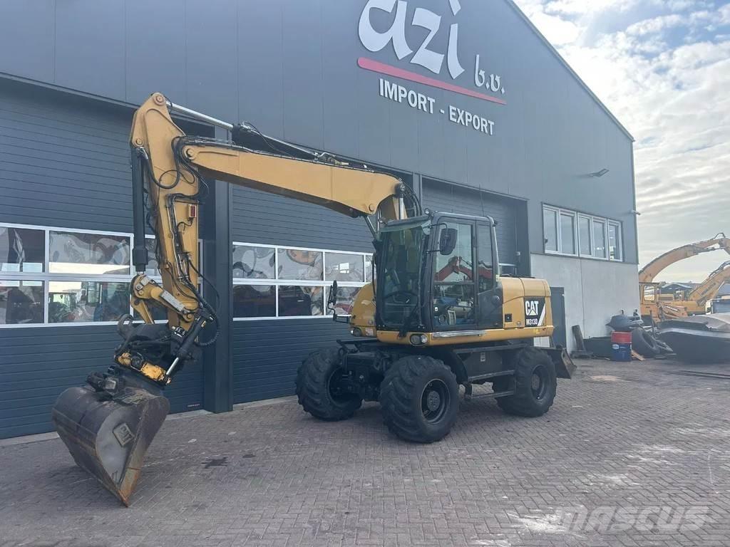 CAT M313D Ekskavatori uz riteņiem