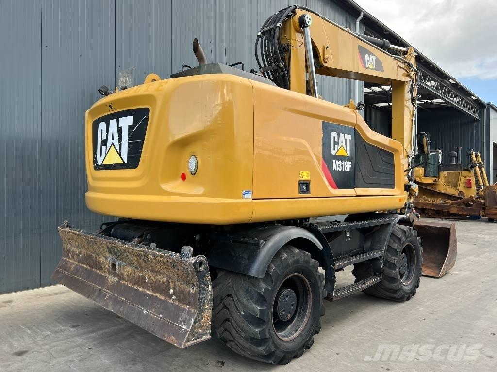 CAT M318F Ekskavatori uz riteņiem