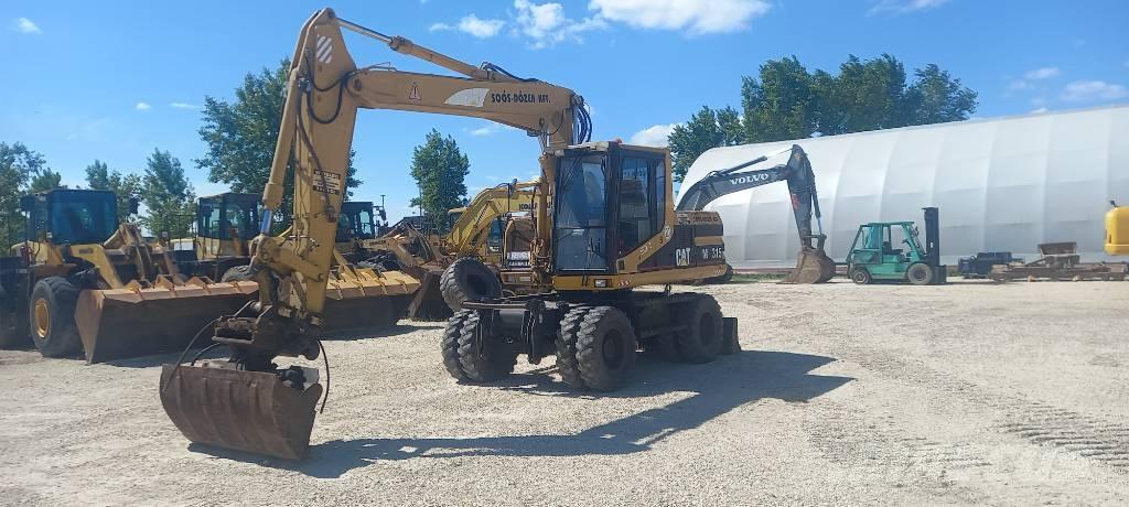 CAT M 315 Ekskavatori uz riteņiem
