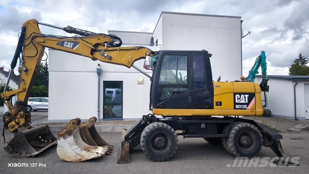 CAT M 313 D Ekskavatori uz riteņiem