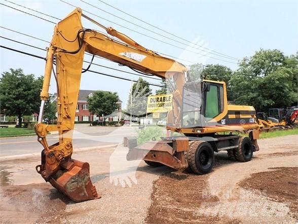 CAT M320 Ekskavatori uz riteņiem
