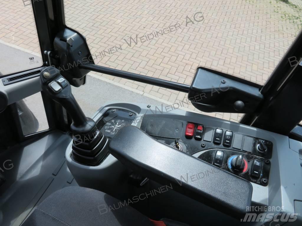 CAT 906M Iekrāvēji uz riteņiem