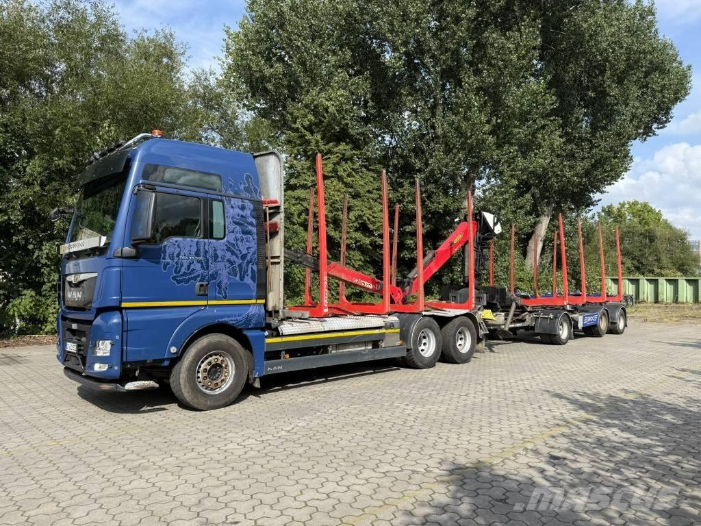 MAN TGX 33.500 Treileri meža tehnikas transportēšanai