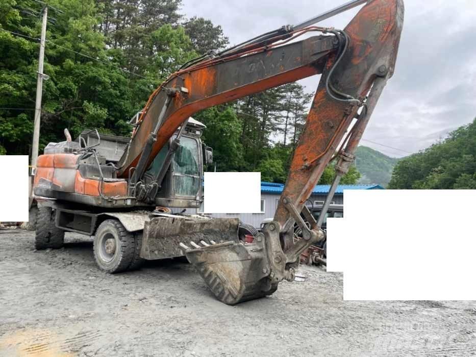 Doosan DX 210 W Ekskavatori uz riteņiem