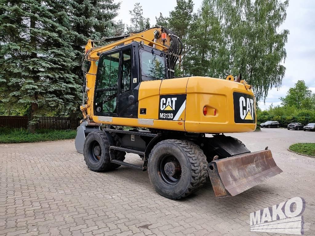 CAT M 313 D Ekskavatori uz riteņiem
