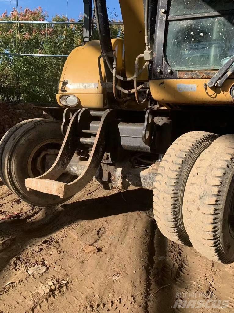 CAT 315 D Ekskavatori uz riteņiem