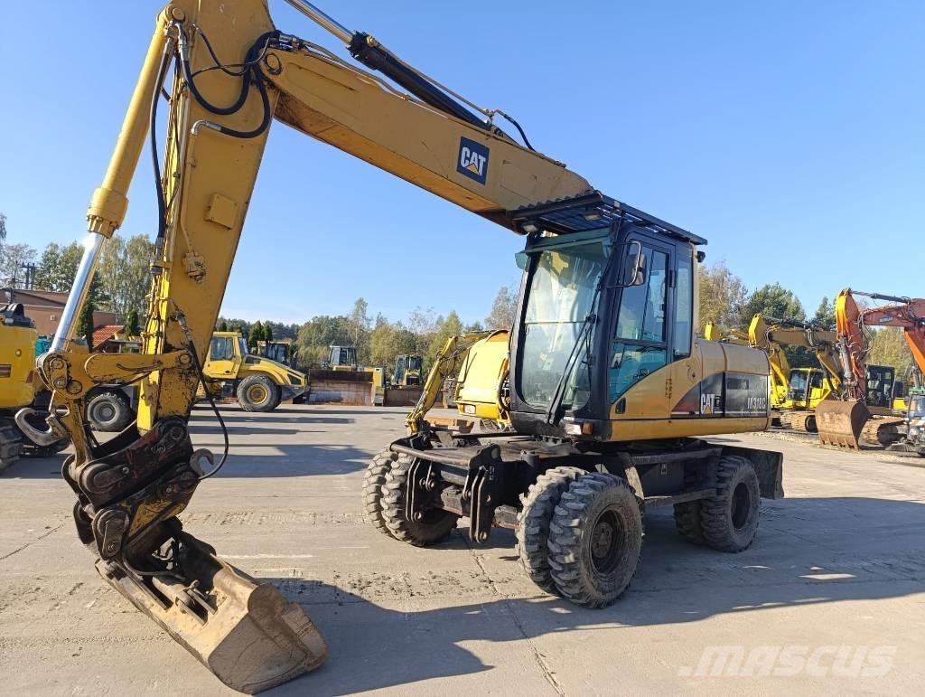 CAT M 318 C Ekskavatori uz riteņiem