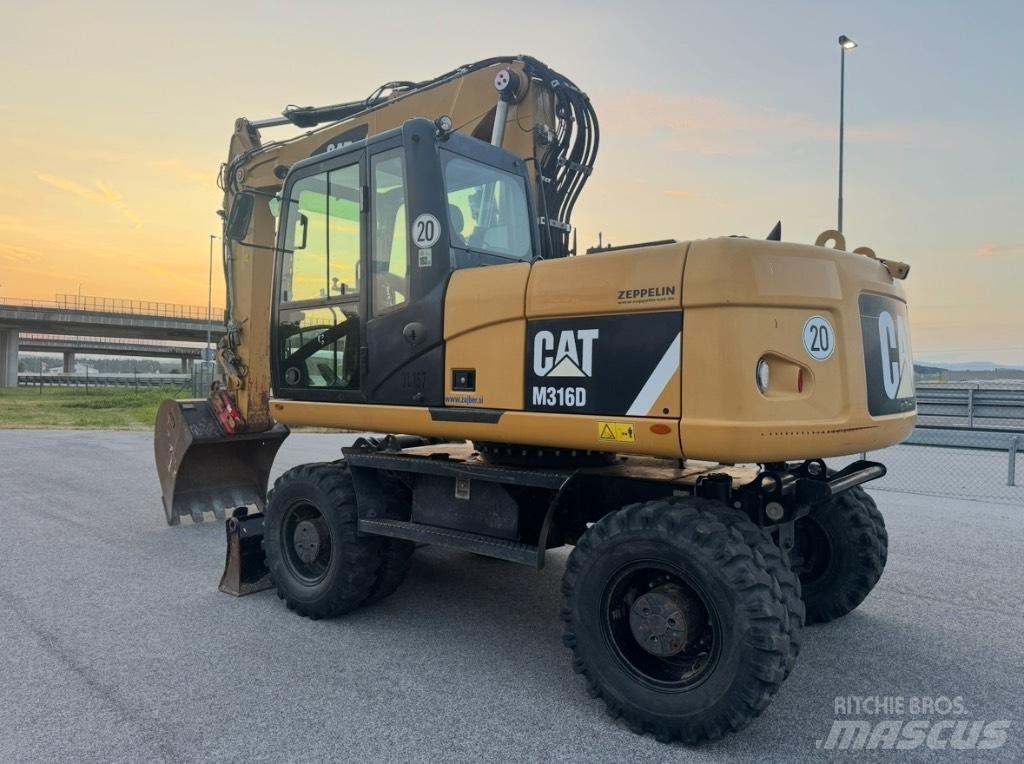 CAT M 316 D Ekskavatori uz riteņiem