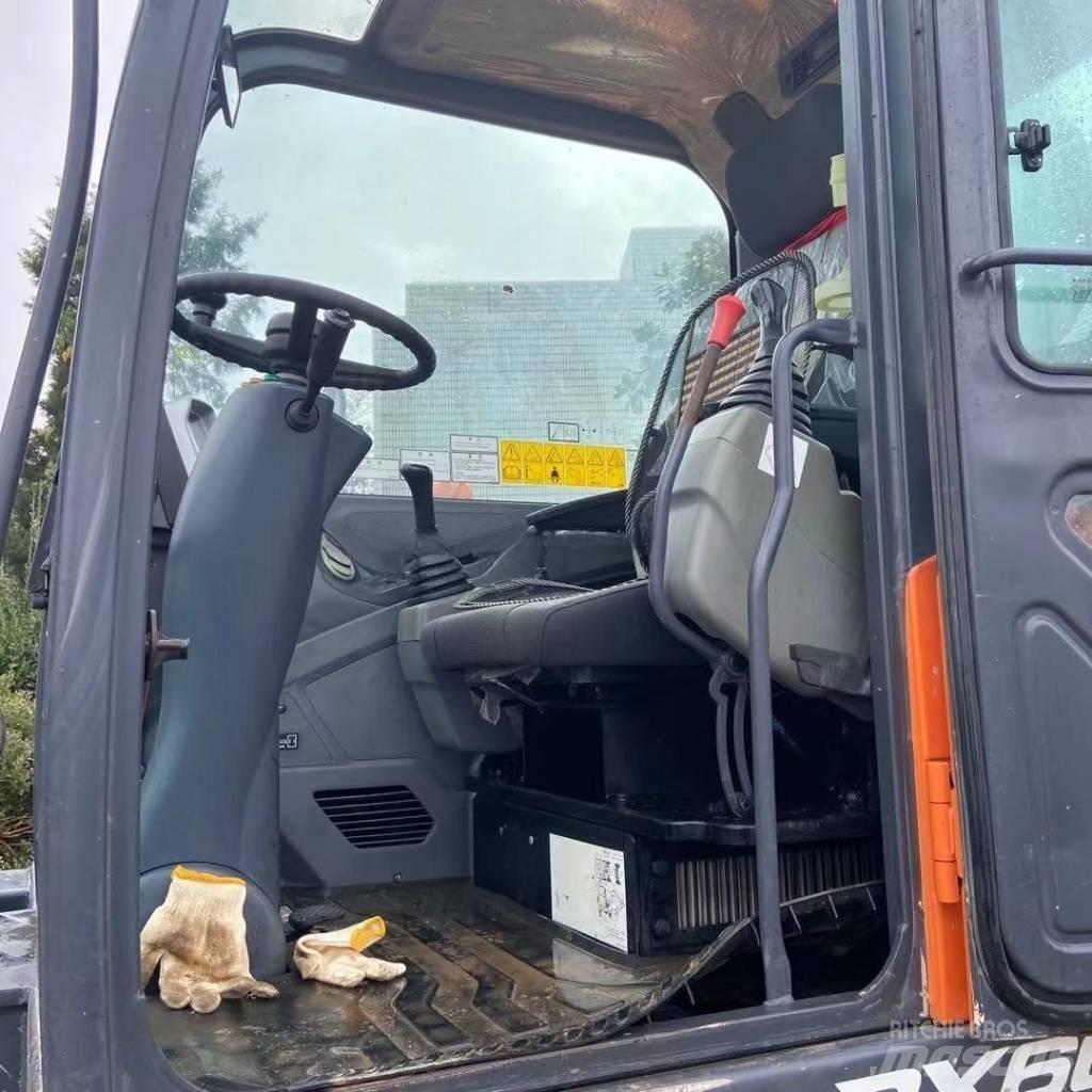 Doosan DX60W Ekskavatori uz riteņiem